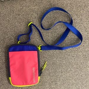 Lululemon neon cross body or hip pack bag.